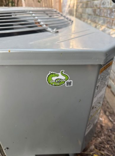 Condenser serviced by Dragon A/C, badged with the company's dragon sticker