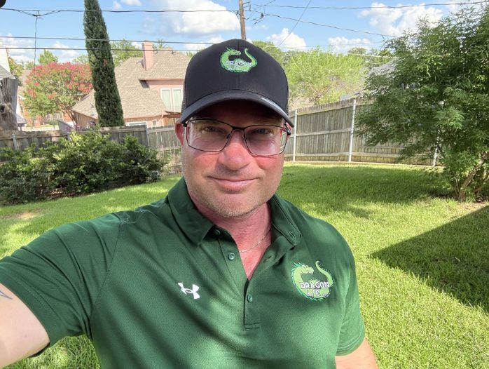 Jeremy Dragon, owner and technician at Dragon A/C LLC, in a Dragon A/C polo and cap